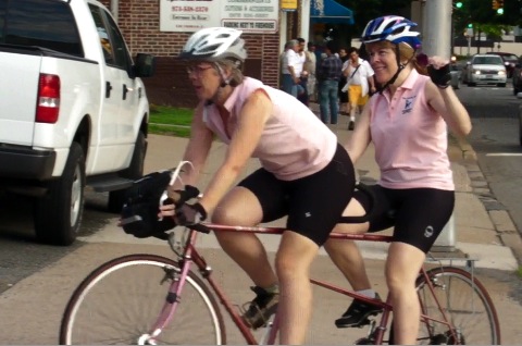 Kirsten Hotchkiss and Ginger Kutsch roll into Marty's Reliable Cycle to register for the Gran Fondo. Photo by Kevin Coughlin